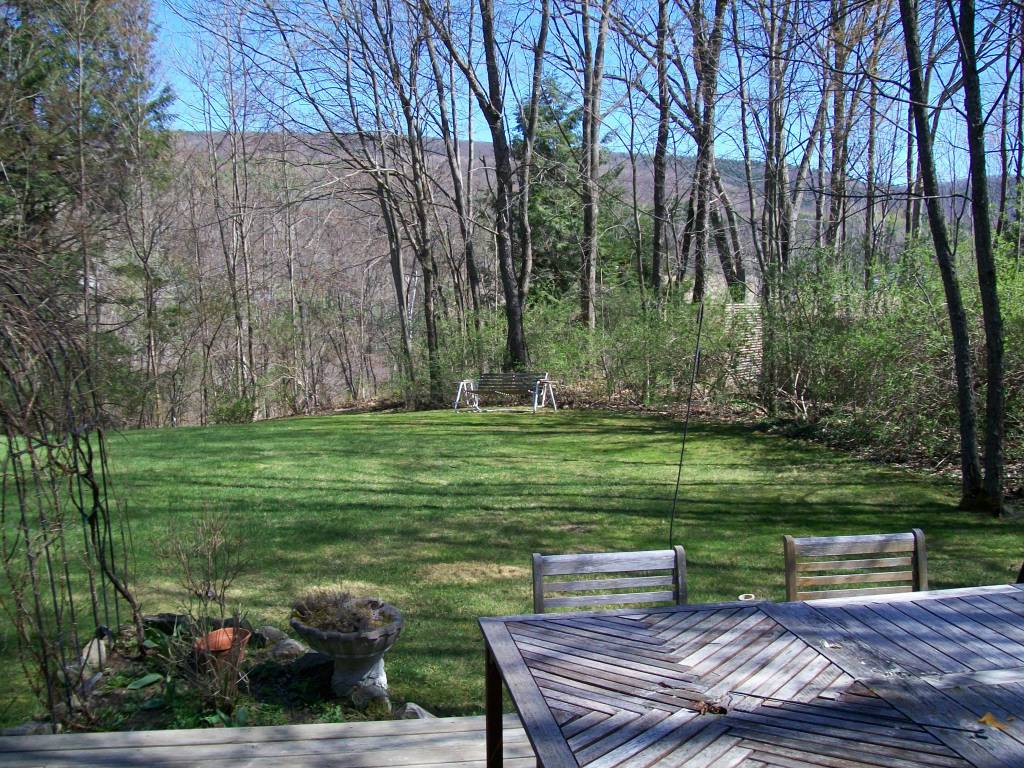 5 Iron Mine Road West Stockbridge, MA 01266 - Photo 12 of 19 a view of a bench in the garden near a lake