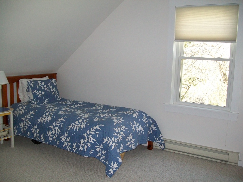 5 Iron Mine Road West Stockbridge, MA 01266 - Photo 16 of 19 a bed sitting in a bedroom next to a window