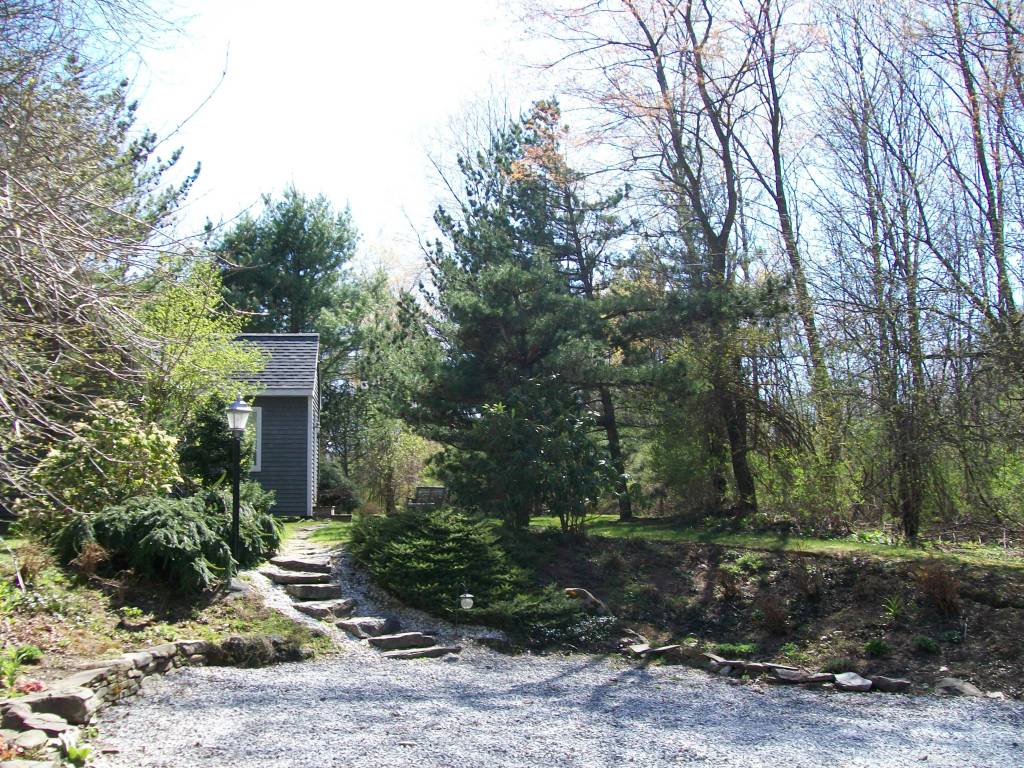5 Iron Mine Road West Stockbridge, MA 01266 - Photo 19 of 19 a view of a garden with potted plants and large trees