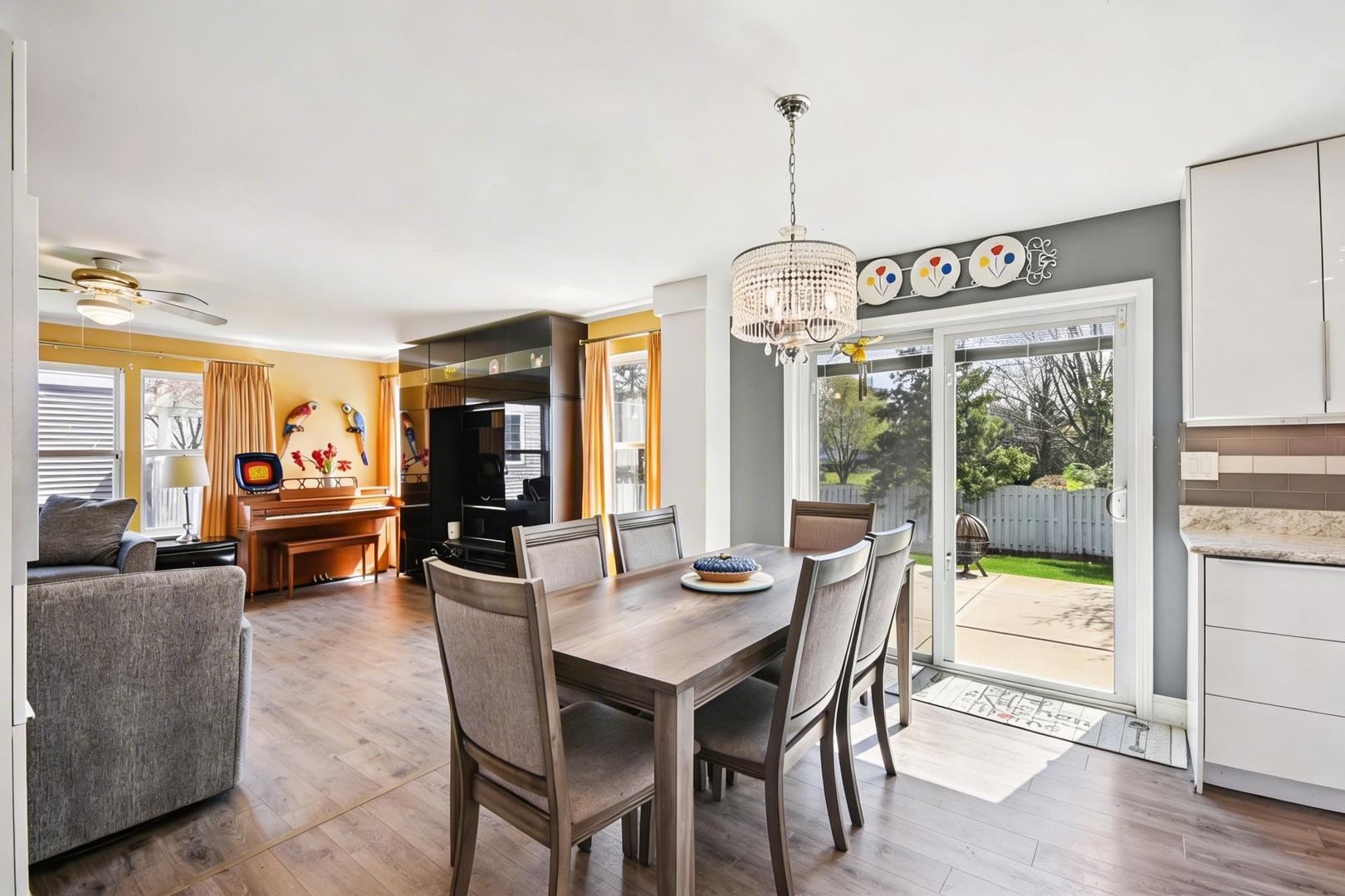 1739 Newbridge Circle Elgin, IL 60123 - Photo 11 of 42 a view of a dining room with furniture window and wooden floor