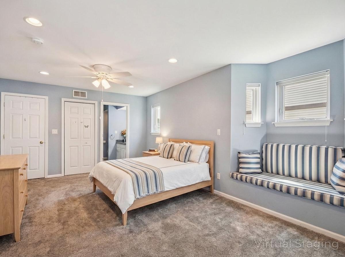 1739 Newbridge Circle Elgin, IL 60123 - Photo 19 of 42 a spacious bedroom with a bed and a couch