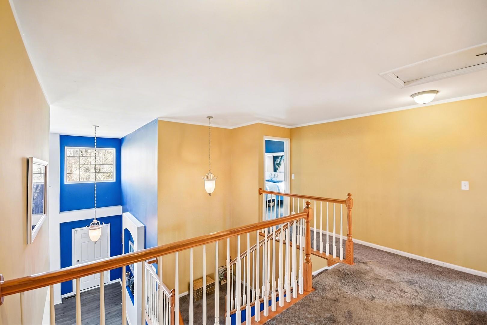1739 Newbridge Circle Elgin, IL 60123 - Photo 22 of 42 a view of a hallway with a window