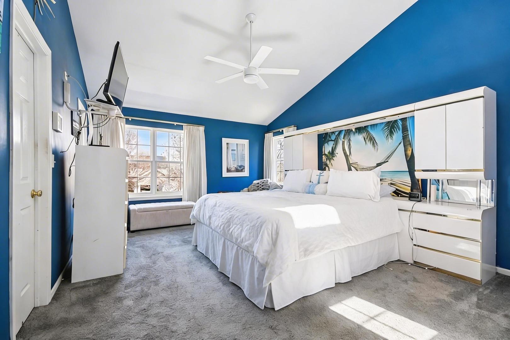 1739 Newbridge Circle Elgin, IL 60123 - Photo 23 of 42 a bedroom with a large bed and a window