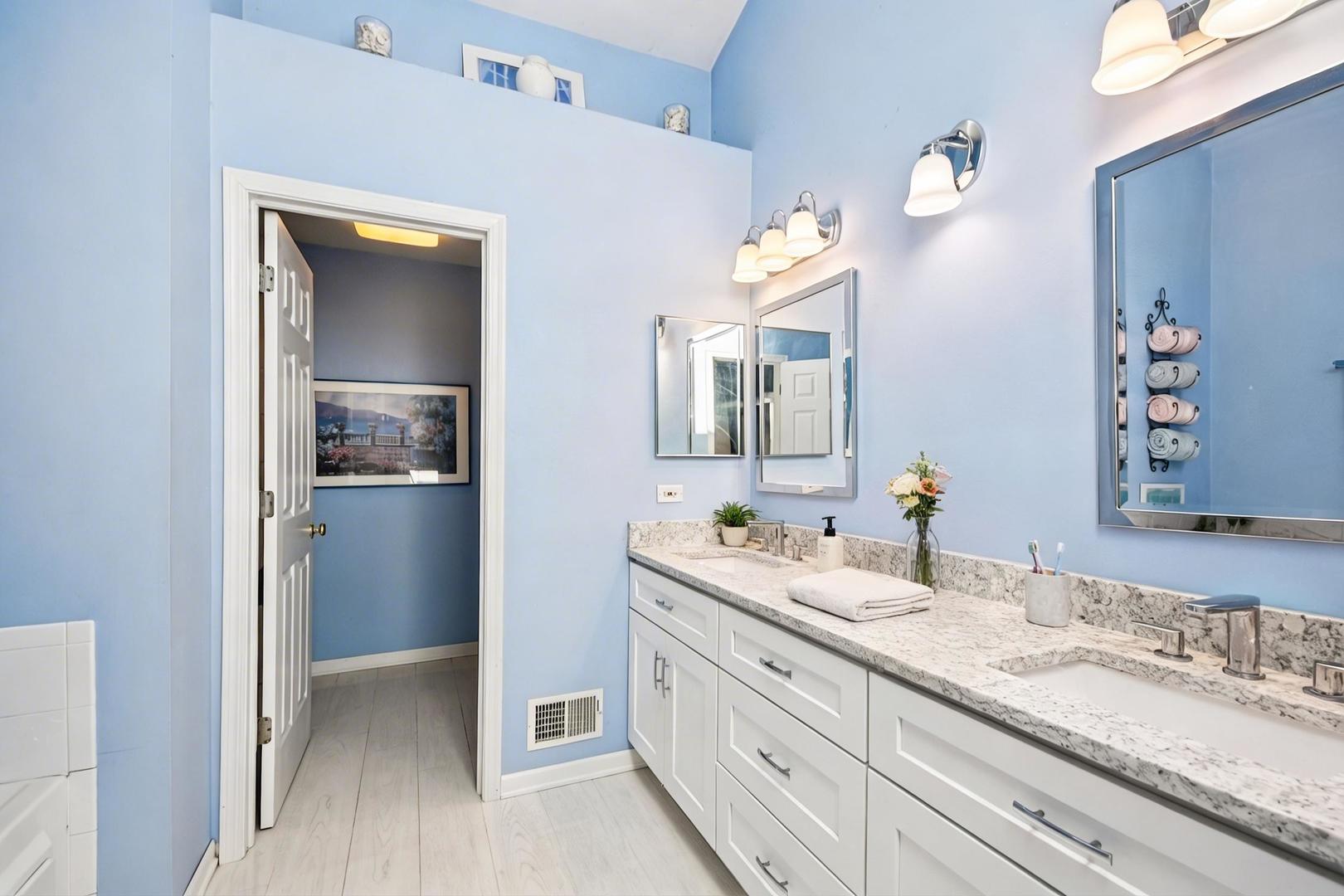 1739 Newbridge Circle Elgin, IL 60123 - Photo 25 of 42 a bathroom with a granite countertop double vanity sink and mirror
