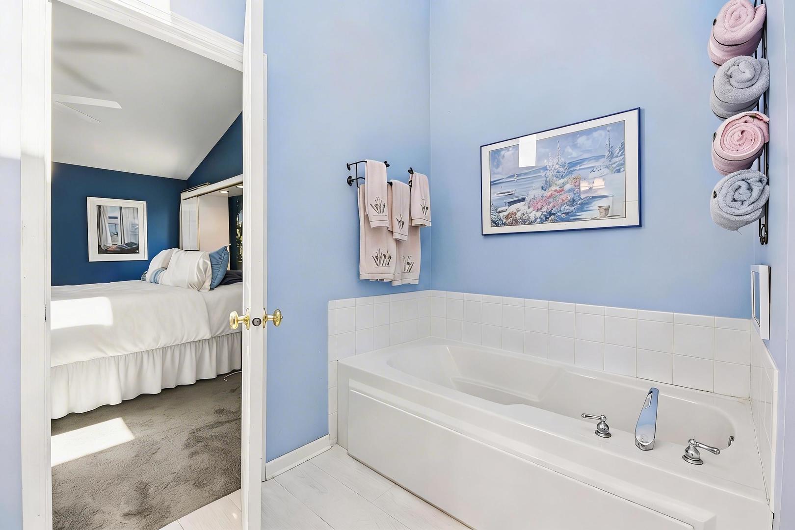 1739 Newbridge Circle Elgin, IL 60123 - Photo 26 of 42 a bathroom with a bathtub and a baby crib