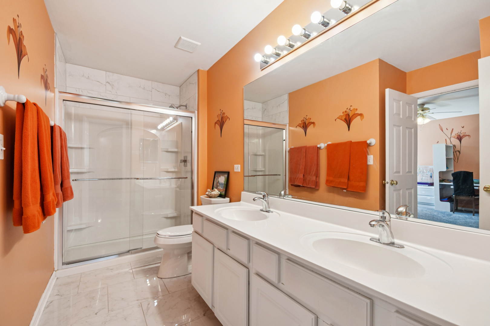 1739 Newbridge Circle Elgin, IL 60123 - Photo 29 of 42 a bathroom with a double vanity sink toilet mirror and shower