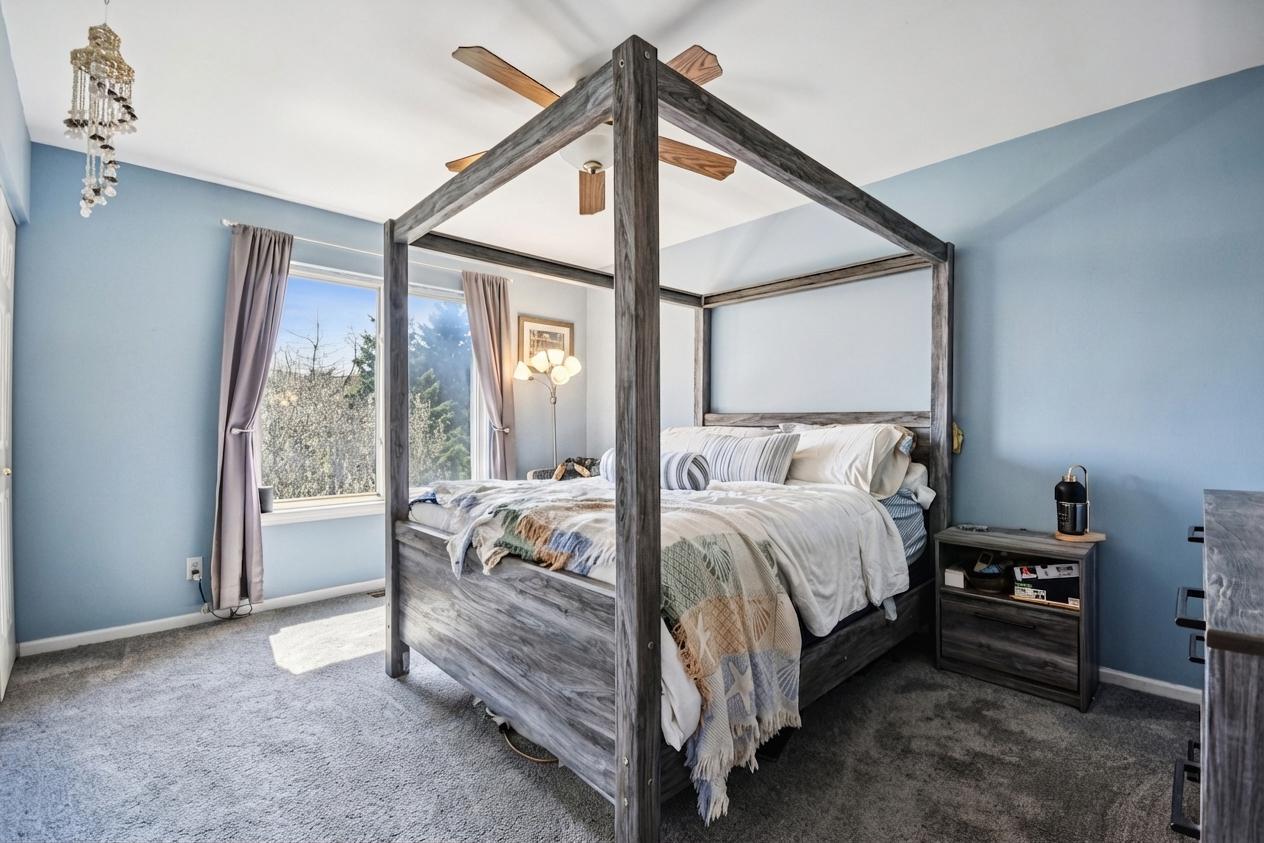 1739 Newbridge Circle Elgin, IL 60123 - Photo 30 of 42 a bed room with a bed and a chair