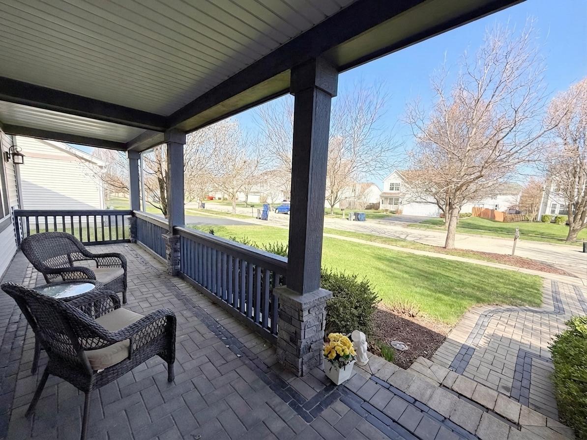 1739 Newbridge Circle Elgin, IL 60123 - Photo 3 of 42 a view of a porch with furniture and garden