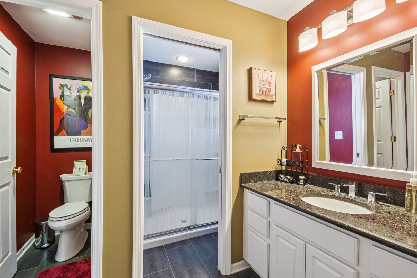 1739 Newbridge Circle Elgin, IL 60123 - Photo 33 of 42 a bathroom with a granite countertop sink and a mirror
