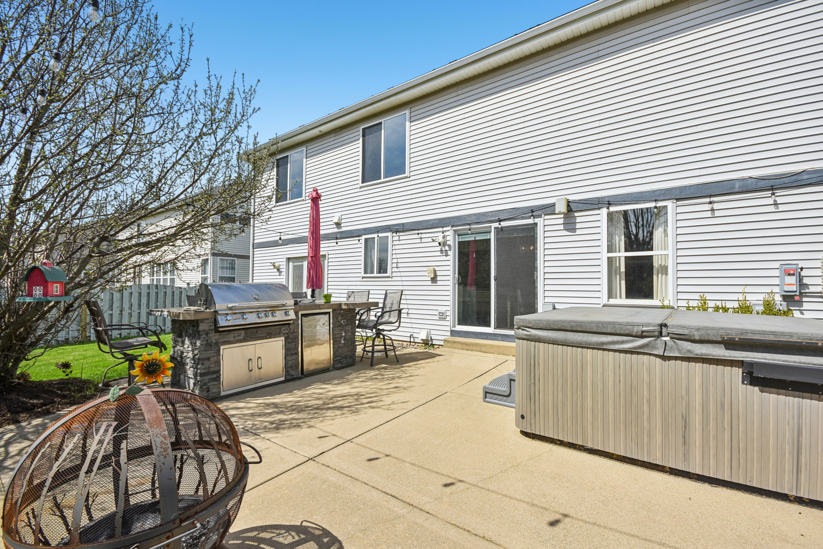 1739 Newbridge Circle Elgin, IL 60123 - Photo 39 of 42 a view of a dinning table and chairs in patio of the house