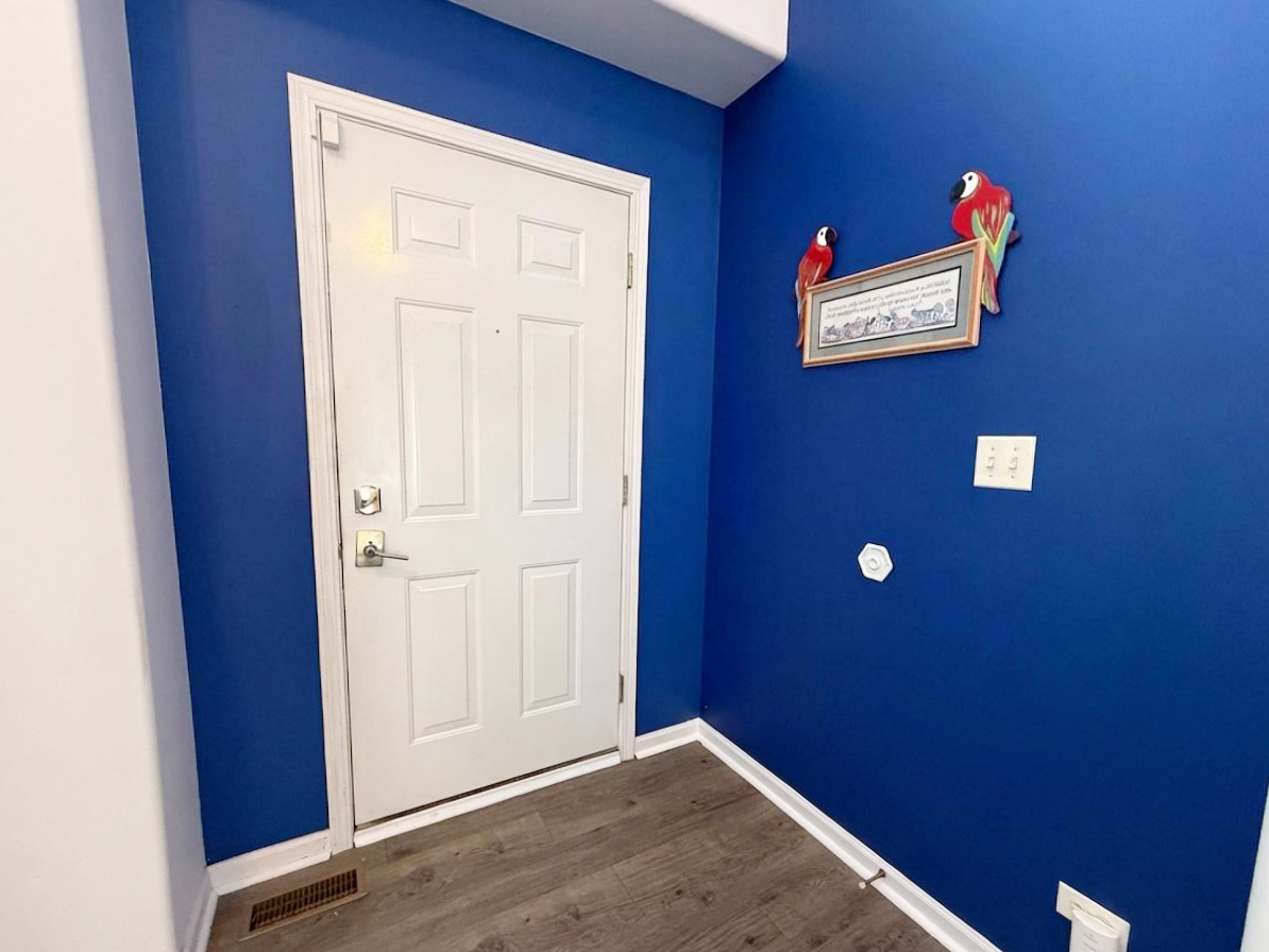 1739 Newbridge Circle Elgin, IL 60123 - Photo 4 of 42 a view of a hallway with wooden floor