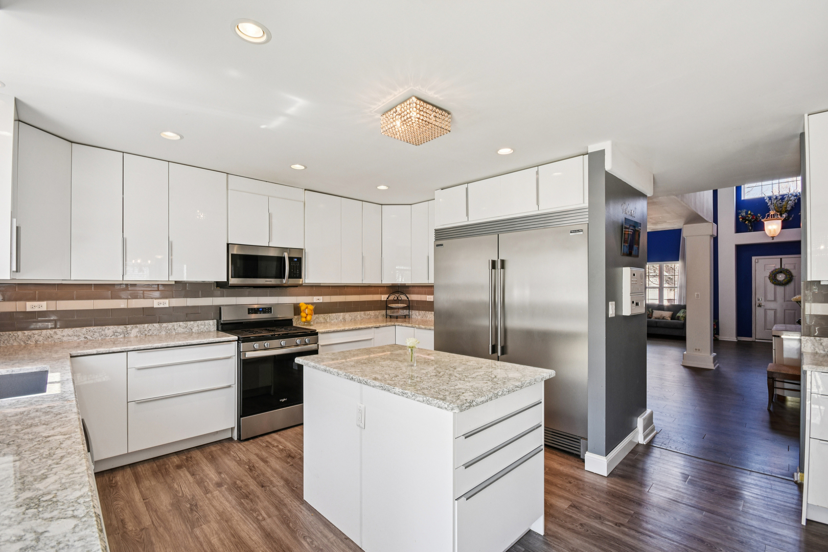 1739 Newbridge Circle Elgin, IL 60123 - Photo 9 of 42 a kitchen with stainless steel appliances granite countertop a refrigerator stove microwave and cabinets
