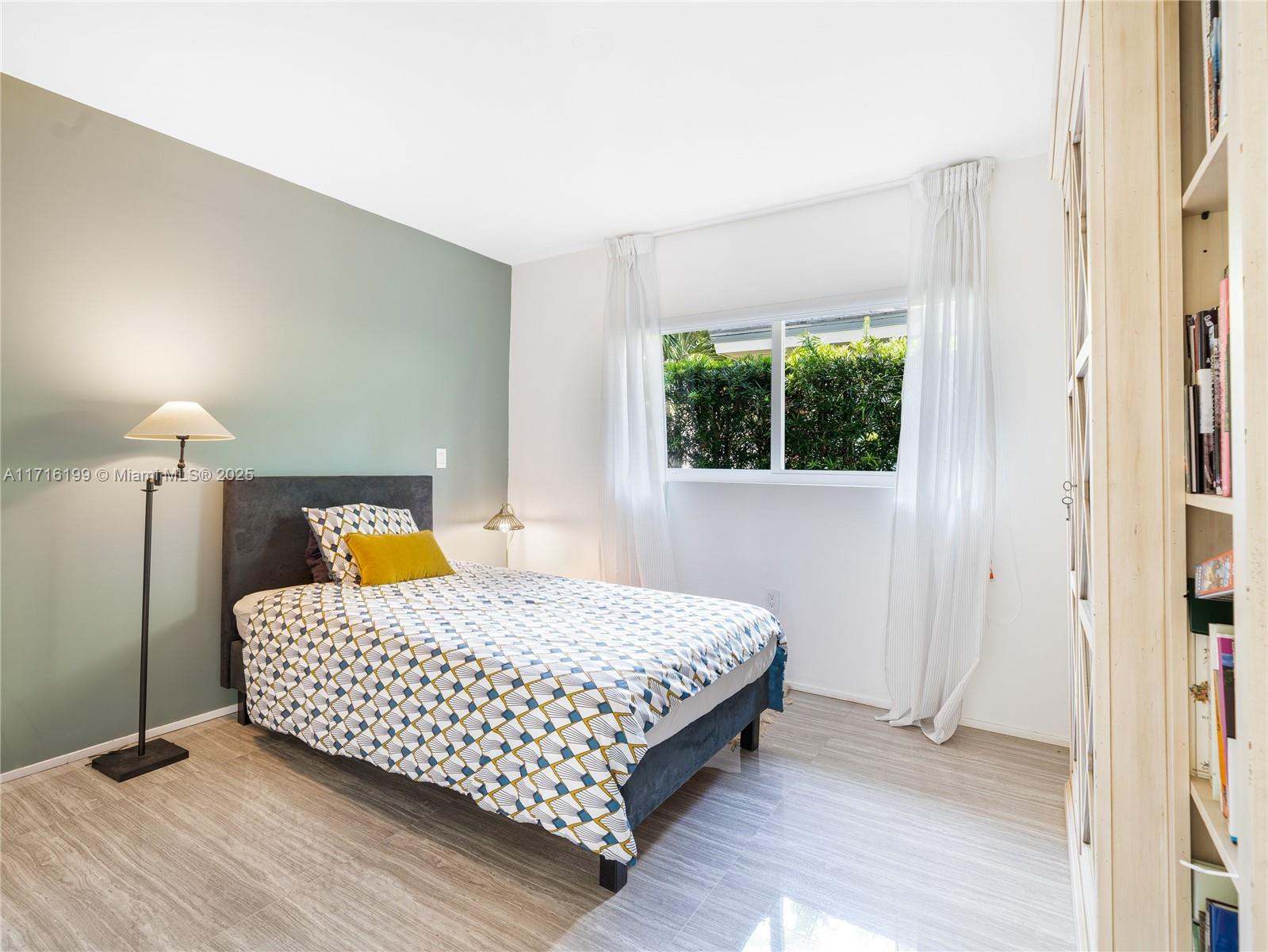 203 Ridgewood Road Coral Gables, FL 33133 - Photo 28 of 46 a bedroom with a bed and window