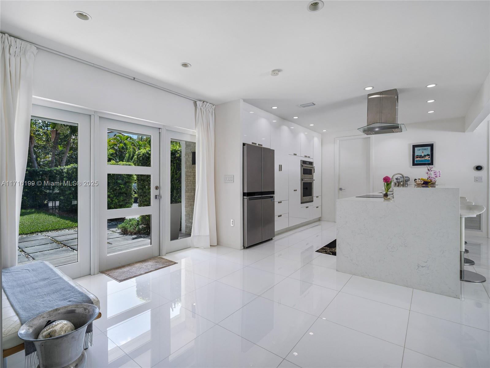 203 Ridgewood Road Coral Gables, FL 33133 - Photo 6 of 46 a view of a kitchen with refrigerator and windows