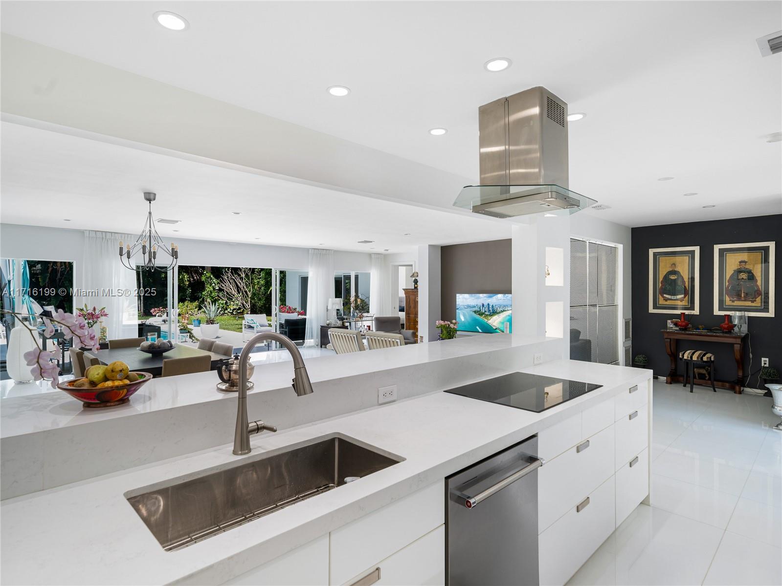203 Ridgewood Road Coral Gables, FL 33133 - Photo 8 of 46 a kitchen with counter top space and living room view
