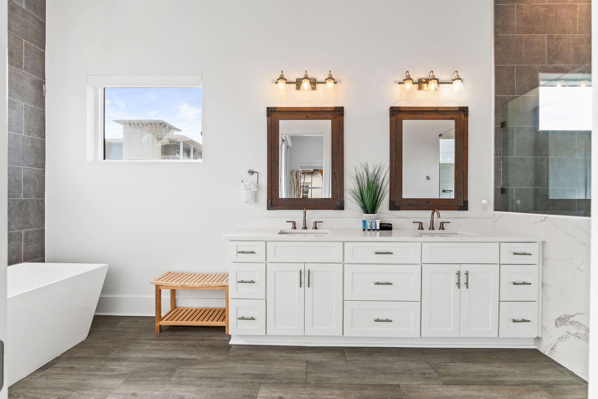 17 Penny Lane Santa Rosa Beach, FL 32459 - Photo 68 of 91 a bathroom with double vanity sinks a toilet a mirror and a window