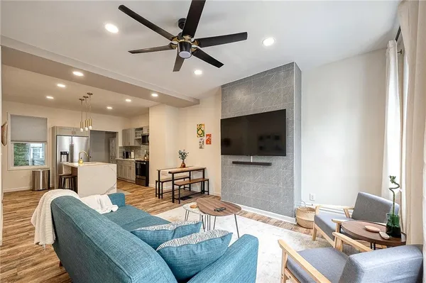 a living room with furniture and a flat screen tv
