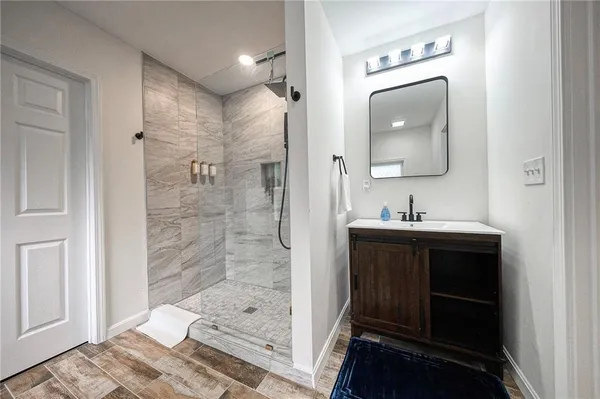 a bathroom with a sink and mirror
