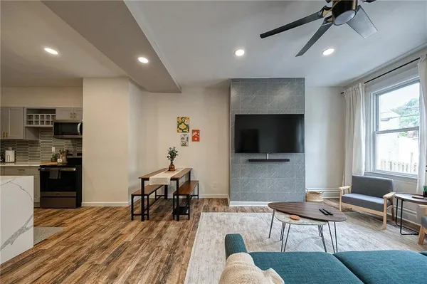 a living room with furniture and a flat screen tv