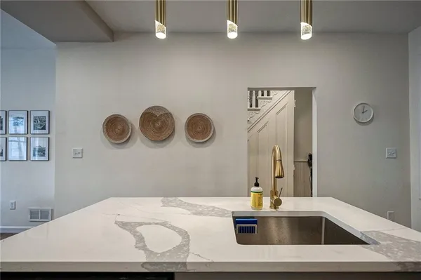 a kitchen with stainless steel appliances granite countertop a stove and cabinets