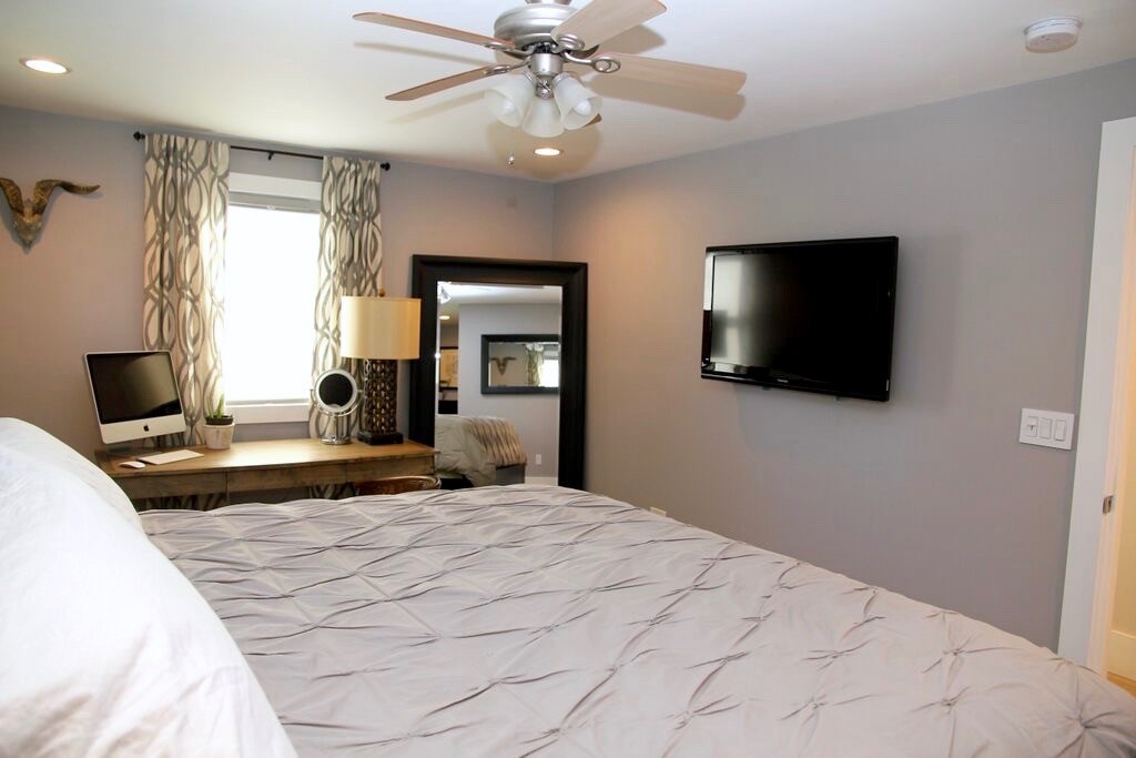 12 Back River Road Amesbury, MA 01913 - Photo 11 of 30 a bedroom with a bed and a flat screen tv