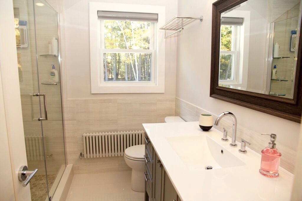 12 Back River Road Amesbury, MA 01913 - Photo 13 of 30 a bathroom with a sink a toilet and a window