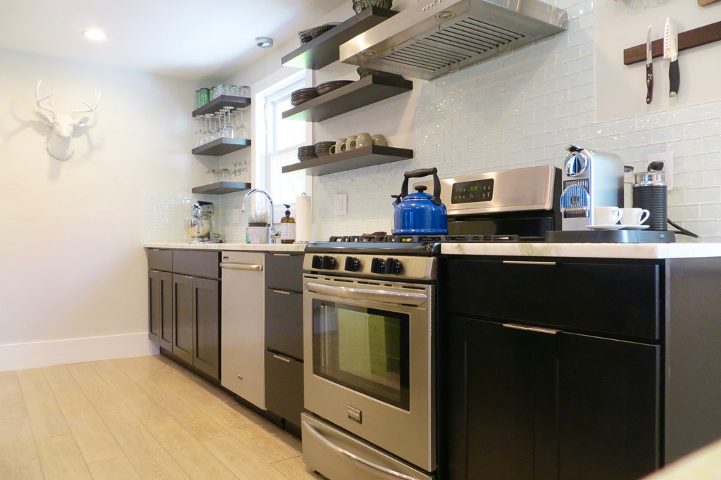 12 Back River Road Amesbury, MA 01913 - Photo 2 of 30 a kitchen with stainless steel appliances granite countertop a stove and a sink