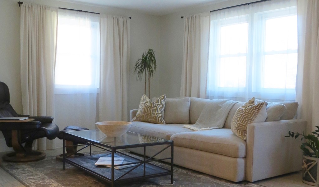 12 Back River Road Amesbury, MA 01913 - Photo 5 of 30 a living room with a couch and a window