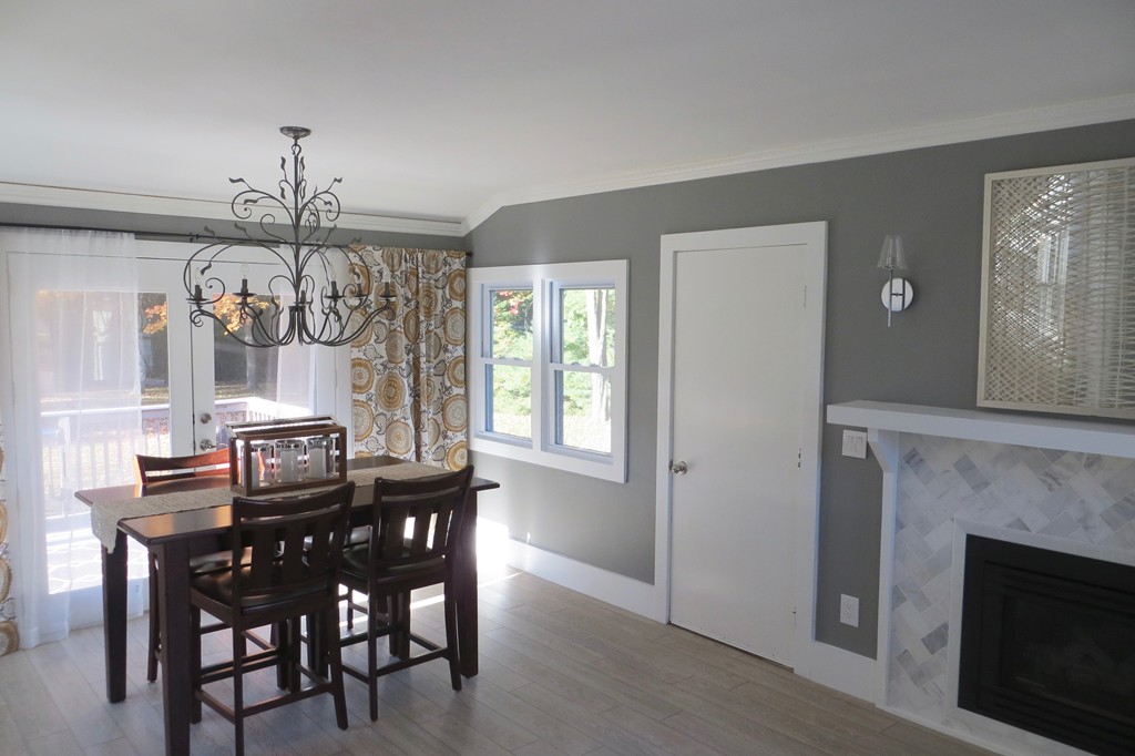 12 Back River Road Amesbury, MA 01913 - Photo 8 of 30 a view of a dining room with furniture window and wooden floor