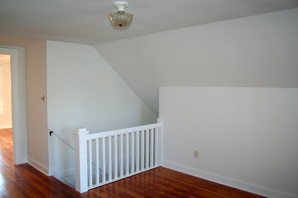 99 Eddy Street Springfield, MA 01104 - Photo 11 of 13 a view of a hallway with wooden floor