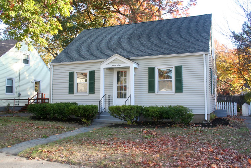 99 Eddy Street Springfield, MA 01104 - Photo 2 of 13 a front view of a house with garden