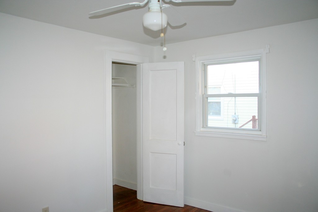 99 Eddy Street Springfield, MA 01104 - Photo 9 of 13 an empty room with a window