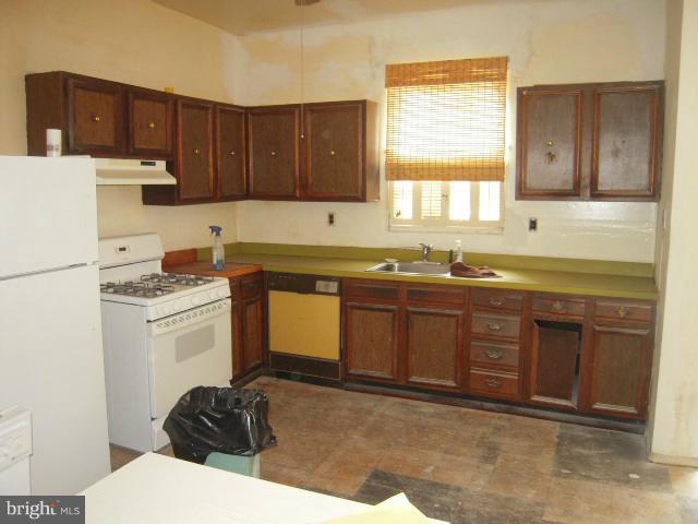 507 K Street Northeast Washington, DC 20002 - Photo 5 of 9 a kitchen with a sink stove and refrigerator