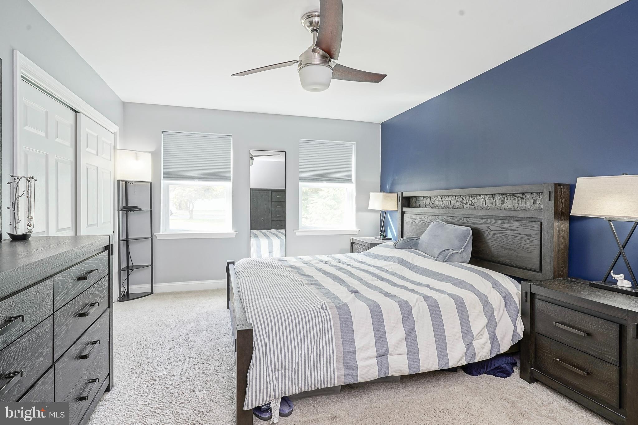 407 Hamilton Road Glassboro, NJ 08028 - Photo 12 of 31 a bedroom with a large bed and a chandelier
