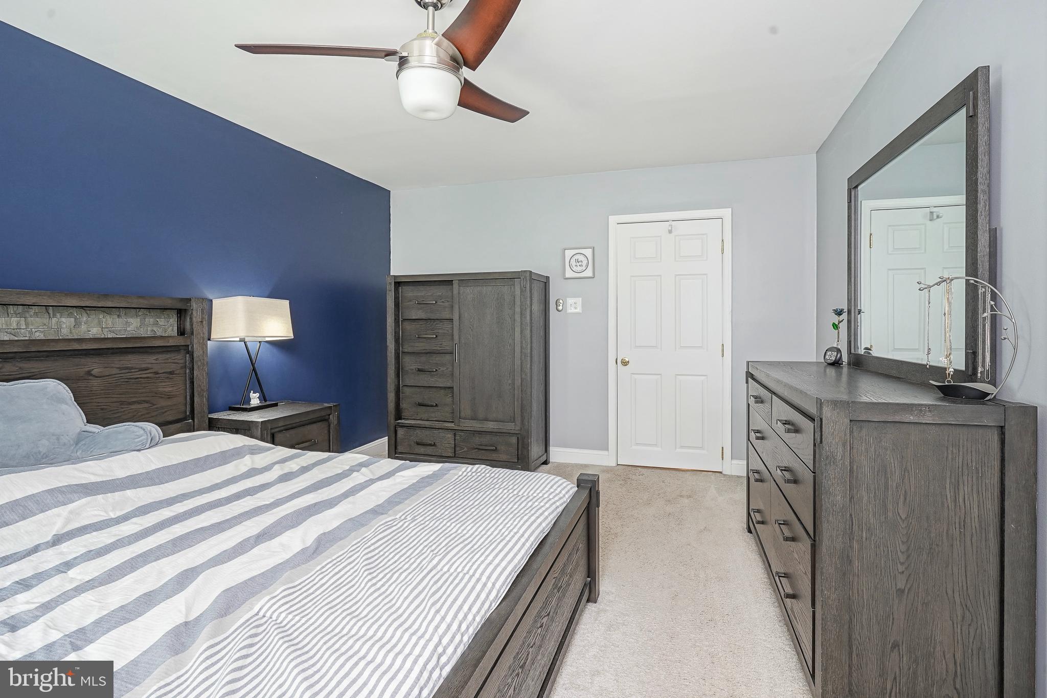407 Hamilton Road Glassboro, NJ 08028 - Photo 14 of 31 a spacious bedroom with a large bed and dresser