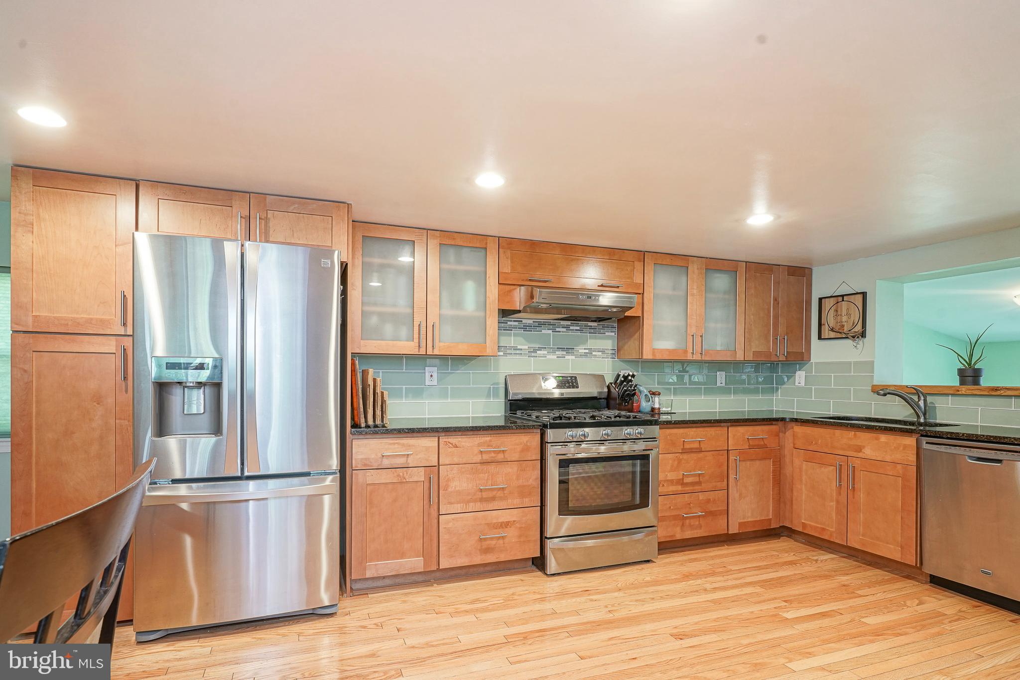 407 Hamilton Road Glassboro, NJ 08028 - Photo 2 of 31 a kitchen with stainless steel appliances granite countertop a refrigerator sink and stove