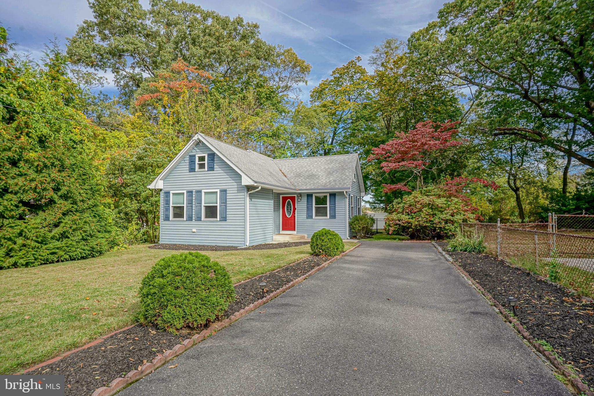 407 Hamilton Road Glassboro, NJ 08028 - Photo 30 of 31 a view of a house with a yard and potted plants