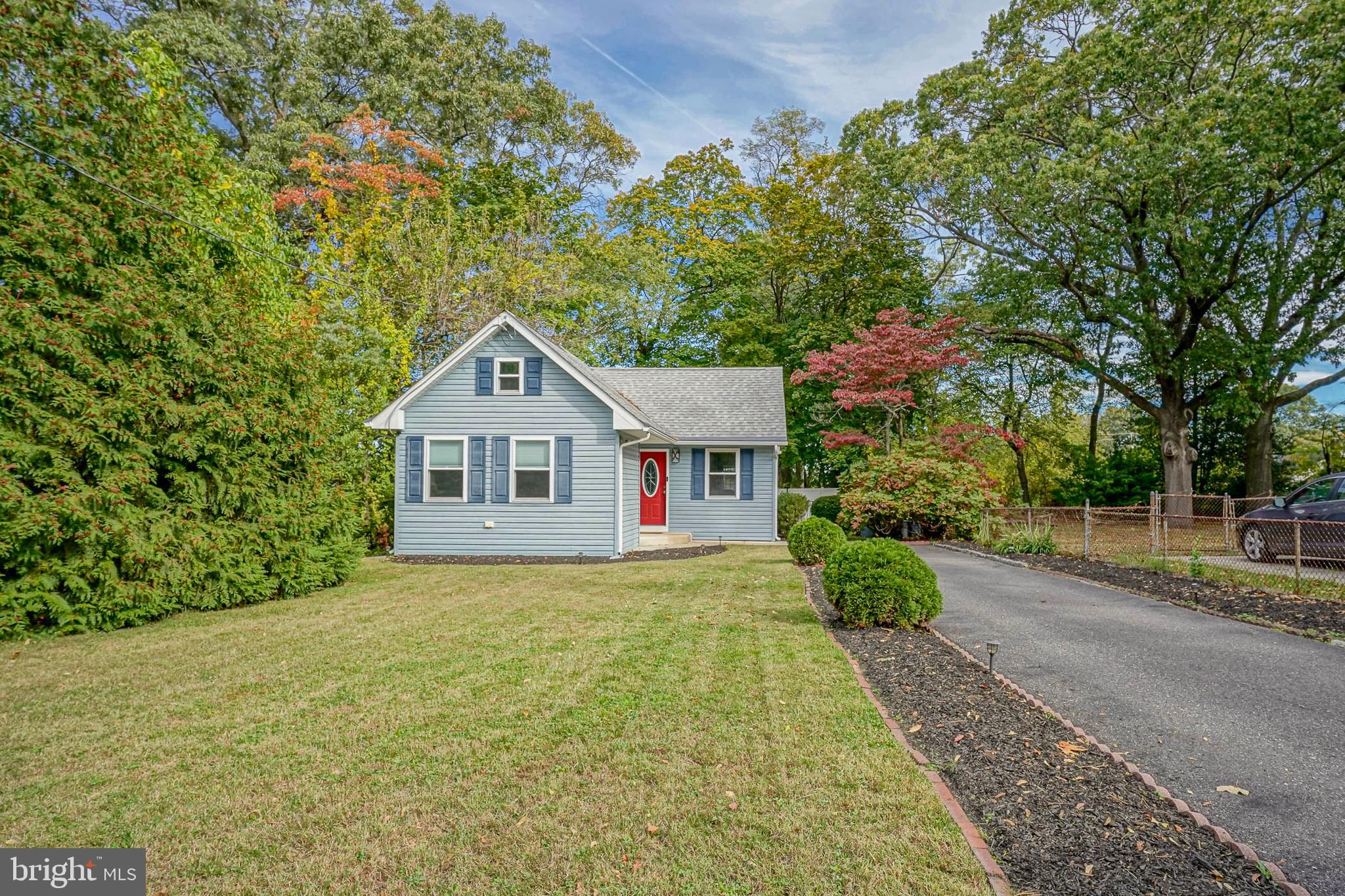 407 Hamilton Road Glassboro, NJ 08028 - Photo 31 of 31 a house with trees in the background