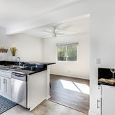 a kitchen with stainless steel appliances granite countertop a stove and a sink