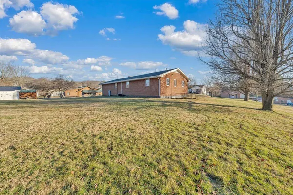 a view of a house with a big yard