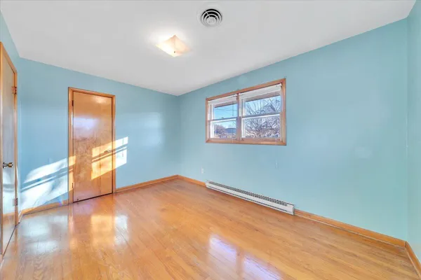 a view of an empty room with a window