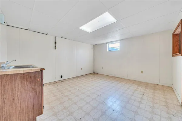 a view of an empty room with closet