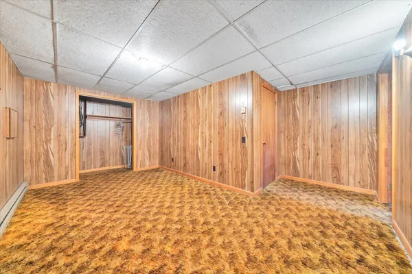 a view of room with furniture and a window