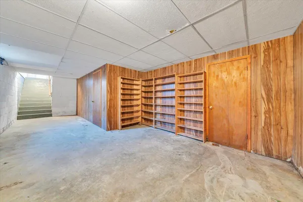 a view of a big room with wooden walls