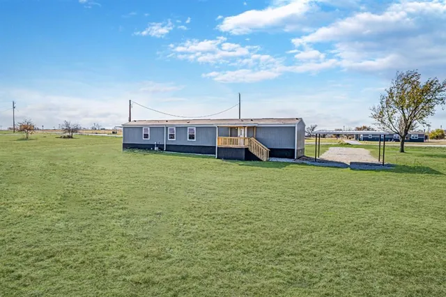 a view of a house with a big yard