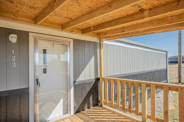 a view of balcony with wooden floor