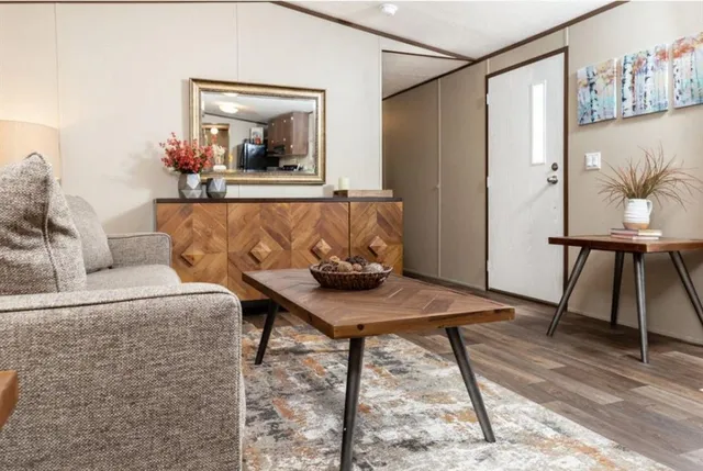 a living room with a couch and a table