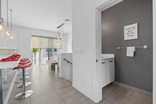 a kitchen with stainless steel appliances a refrigerator sink and microwave