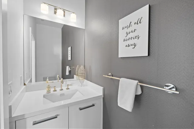 a bedroom with a bed and large window