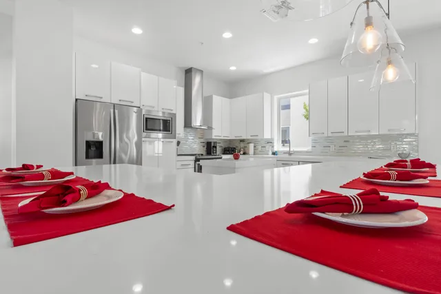 a spacious bathroom with a toilet a sink and a mirror
